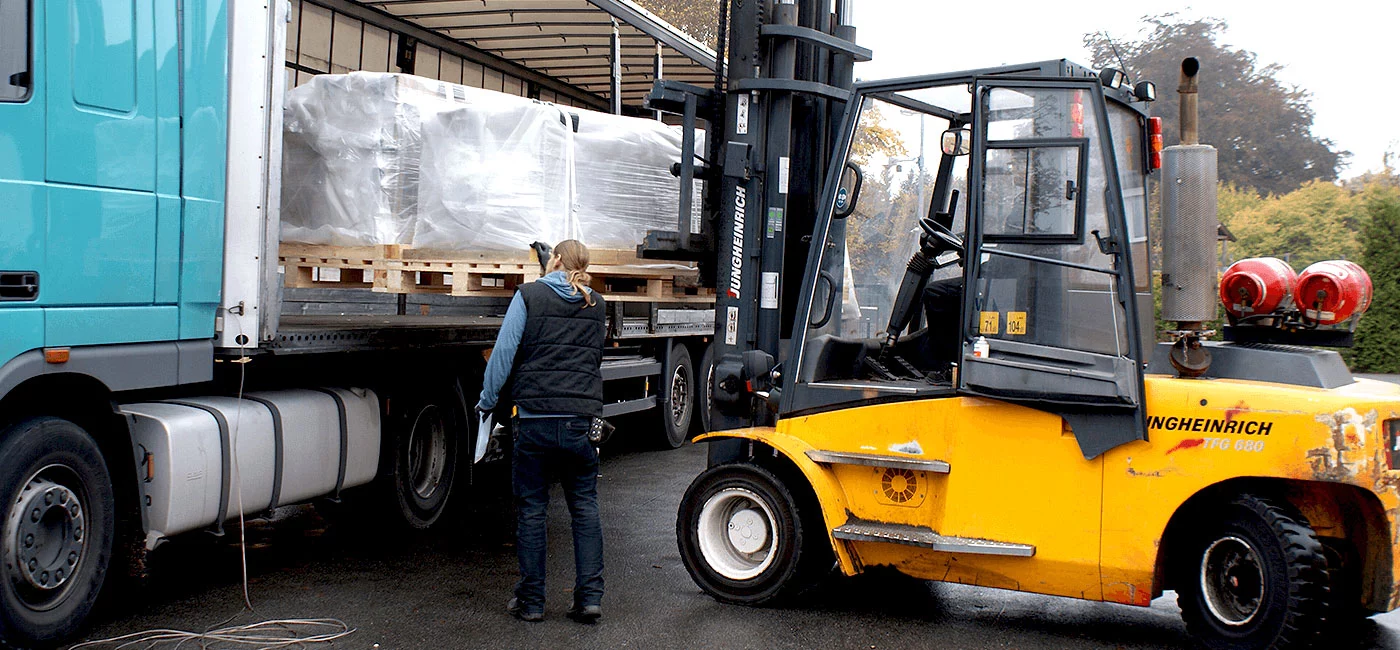 Loading of machine parts into a truck using a lift truck